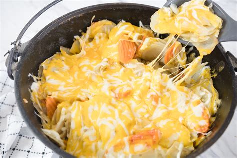Dutch Oven Potatoes with Cheese - Devour Dinner
